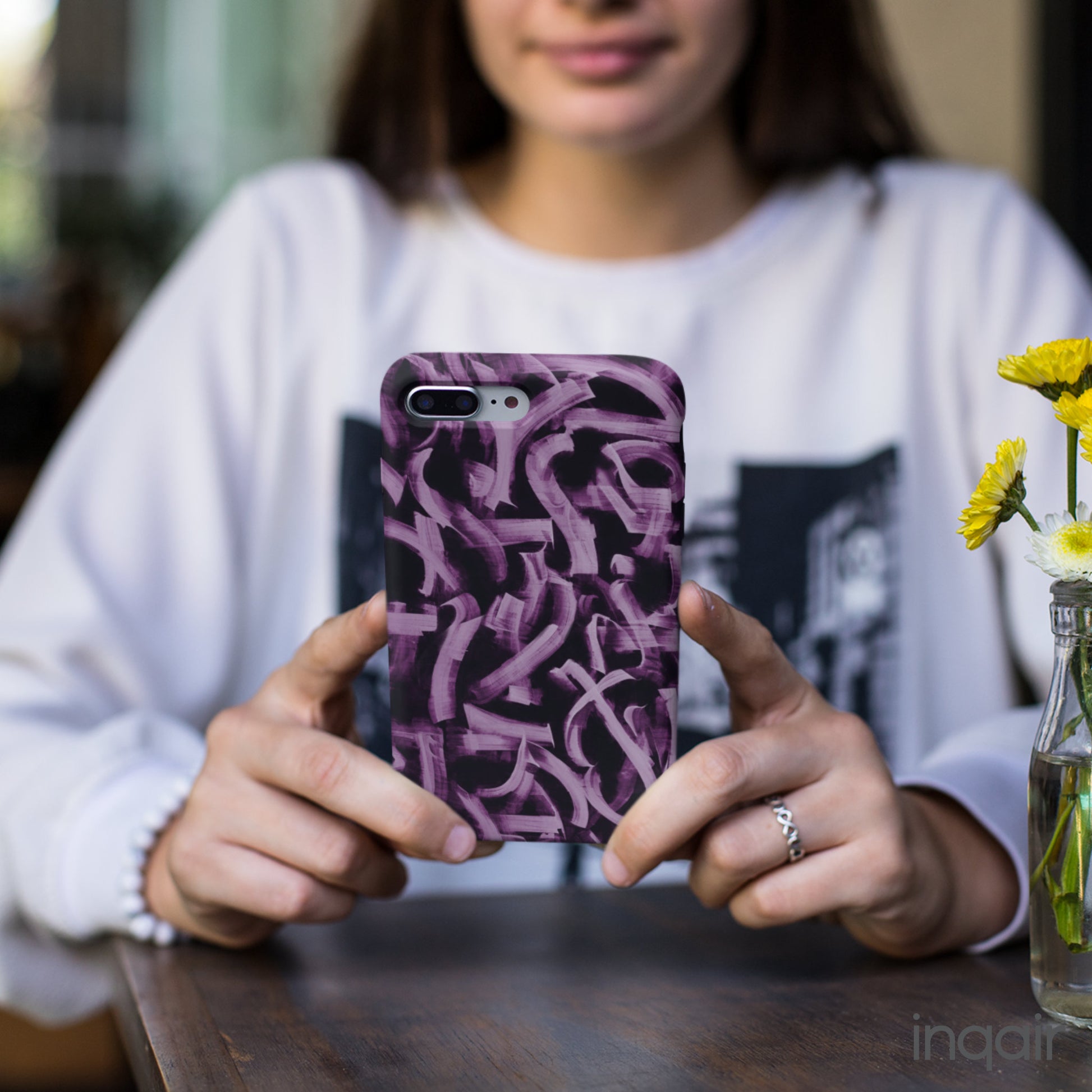 Black phone case with artistic purple brush stroke design compatible with iPhone and Samsung models, stylish and durable protective cover.